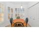 Bright kitchen breakfast nook with wood table and four chairs at 14950 W Mountain View Blvd # 6301, Surprise, AZ 85374
