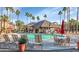 Inviting community pool with lounge chairs and umbrellas at 14950 W Mountain View Blvd # 6301, Surprise, AZ 85374