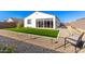 Landscaped backyard with artificial turf and seating area at 17765 W Silverwood Dr, Goodyear, AZ 85338