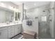 Elegant bathroom with double vanity, large shower, and modern fixtures at 17765 W Silverwood Dr, Goodyear, AZ 85338