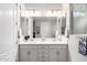 Double sink bathroom with bright lighting and modern cabinetry at 17765 W Silverwood Dr, Goodyear, AZ 85338