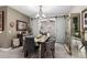 Open dining room showcasing a rustic table and modern lighting at 17765 W Silverwood Dr, Goodyear, AZ 85338