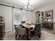 Elegant dining room with a wooden table, gray chairs, and decorative accents at 17765 W Silverwood Dr, Goodyear, AZ 85338