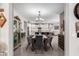 Dining room with a view into a well-equipped kitchen at 17765 W Silverwood Dr, Goodyear, AZ 85338