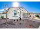 One-story home with gray garage door and drought-tolerant landscaping at 17765 W Silverwood Dr, Goodyear, AZ 85338