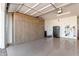 Garage with built-in cabinets and refrigerator at 17765 W Silverwood Dr, Goodyear, AZ 85338