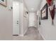 Bright hallway with tile floors and neutral wall colors at 17765 W Silverwood Dr, Goodyear, AZ 85338