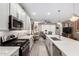 Open concept kitchen with island and stainless steel appliances at 17765 W Silverwood Dr, Goodyear, AZ 85338