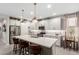 Modern kitchen with white cabinets, stainless steel appliances, and an island at 17765 W Silverwood Dr, Goodyear, AZ 85338