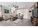 Relaxing living room with comfy seating and a large TV at 17765 W Silverwood Dr, Goodyear, AZ 85338
