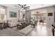 Bright and airy living room with access to a covered patio at 17765 W Silverwood Dr, Goodyear, AZ 85338