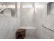 Clean shower with built-in bench and hexagonal floor tiles at 17765 W Silverwood Dr, Goodyear, AZ 85338