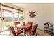 Sunroom with dining table and access to the backyard at 17765 W Silverwood Dr, Goodyear, AZ 85338