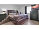 Spacious bedroom with a large bed, dresser, and ample closet space at 1920 W Lindner Ave # 130, Mesa, AZ 85202