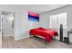 Simple bedroom with a red bedspread and a window at 1920 W Lindner Ave # 130, Mesa, AZ 85202