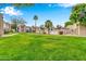 Community features lush landscaping and a pool at 1920 W Lindner Ave # 130, Mesa, AZ 85202