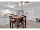 Bright dining area with table and chairs next to kitchen at 1920 W Lindner Ave # 130, Mesa, AZ 85202