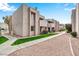 Condo building exterior with landscaping and pathway at 1920 W Lindner Ave # 130, Mesa, AZ 85202