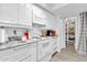 White kitchen cabinets, granite countertops, and appliances at 1920 W Lindner Ave # 130, Mesa, AZ 85202