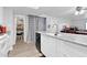 Modern kitchen with white cabinets, granite counters, and stainless steel appliances at 1920 W Lindner Ave # 130, Mesa, AZ 85202