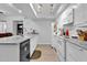 Modern kitchen with white cabinets, granite counters, and island at 1920 W Lindner Ave # 130, Mesa, AZ 85202