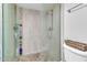 Modern shower with glass enclosure and pebble floor at 1920 W Lindner Ave # 130, Mesa, AZ 85202