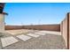 Backyard view showing gravel, pathways, and block wall at 19436 S 208Th Pl, Queen Creek, AZ 85142