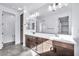 Elegant bathroom with double vanity, large mirror, and modern fixtures at 19436 S 208Th Pl, Queen Creek, AZ 85142