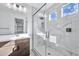 Spa-like bathroom with a walk-in shower, marble tile, and modern vanity at 19436 S 208Th Pl, Queen Creek, AZ 85142