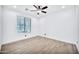 Spacious bedroom with wood-look floors and a large window at 19436 S 208Th Pl, Queen Creek, AZ 85142