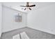 Well-lit bedroom with ceiling fan and window at 19436 S 208Th Pl, Queen Creek, AZ 85142