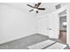 Bedroom with ceiling fan and double doors to closet at 19436 S 208Th Pl, Queen Creek, AZ 85142