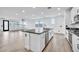 Open concept kitchen with island, stainless steel appliances, and access to living area at 19436 S 208Th Pl, Queen Creek, AZ 85142