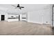 Spacious living room with wood-look floors and an open floor plan at 19436 S 208Th Pl, Queen Creek, AZ 85142