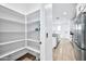 White corner pantry with ample shelving for storage at 19436 S 208Th Pl, Queen Creek, AZ 85142
