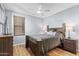Spacious bedroom with a wooden bed frame and large windows at 20100 N 78Th Pl # 2091, Scottsdale, AZ 85255