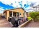 Spacious backyard with patio furniture and built-in grill at 20472 N 90Th Ln, Peoria, AZ 85382