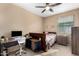 Bright bedroom with a workspace and double bed at 20472 N 90Th Ln, Peoria, AZ 85382