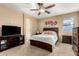Bedroom with ensuite bathroom and TV at 20472 N 90Th Ln, Peoria, AZ 85382