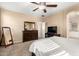 Bedroom with large dresser, TV and full-length mirror at 20472 N 90Th Ln, Peoria, AZ 85382
