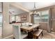 Dining room with rustic farmhouse table and bench at 20472 N 90Th Ln, Peoria, AZ 85382