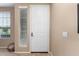 Interior view of a white front door with sidelights at 20472 N 90Th Ln, Peoria, AZ 85382