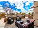 Wicker patio furniture on a paved porch with a view at 20472 N 90Th Ln, Peoria, AZ 85382