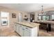 Open kitchen with large island and views to dining area at 20472 N 90Th Ln, Peoria, AZ 85382