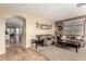 Open living room with views into kitchen and hallway at 20472 N 90Th Ln, Peoria, AZ 85382