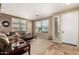 Living room with brown couches and a coffee table at 20472 N 90Th Ln, Peoria, AZ 85382