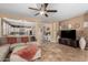Living room with large sectional sofa and TV at 20472 N 90Th Ln, Peoria, AZ 85382