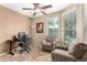 Home office with two chairs and a desk at 20472 N 90Th Ln, Peoria, AZ 85382