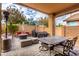 Outdoor patio with seating, grill, and patio heaters at 20472 N 90Th Ln, Peoria, AZ 85382