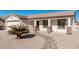 Front view of a single-story house with stone accents and a palm tree at 2101 S Meridian Rd # 268, Apache Junction, AZ 85120